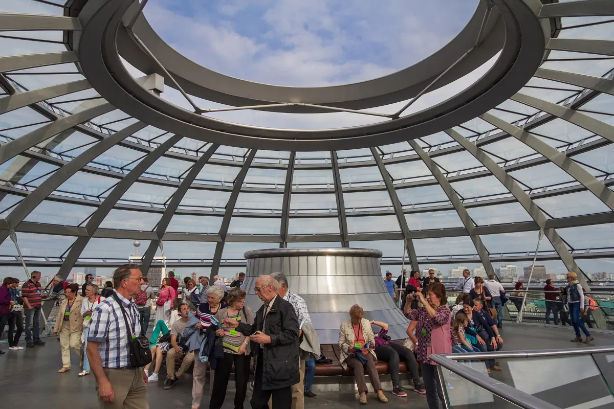 Visitors inside the glass dome of the Reichstag